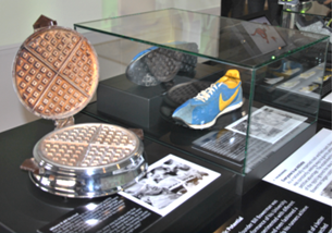 A waffle iron and shoes on display

AI-generated content may be incorrect.