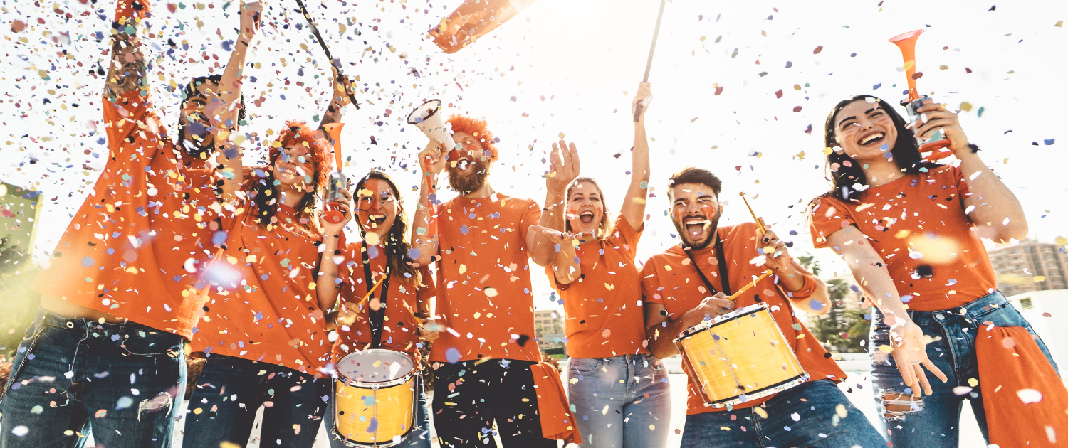 A group of people in orange shirts

AI-generated content may be incorrect., Picture
